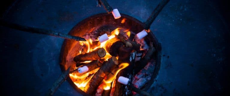 content-marshmallows-roasting-over-wood-burning-fire-pit-768x323