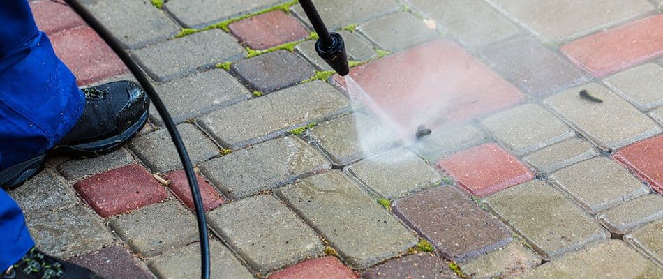 pavers-being-pressure-washed-by-a-professional