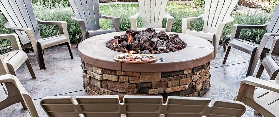 wine-glasses-by-fire-pit-and-chairs